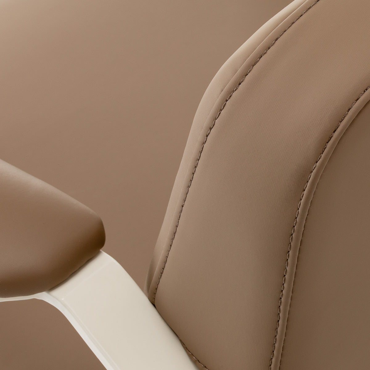 Omega Aurora light brown hairdressing chair with adjustable height and cushioned seat, ideal for salons and styling stations.