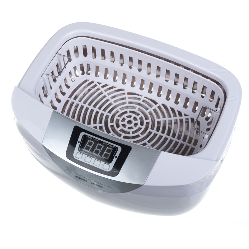 Ultrasound cleaning brush in a 2.5L basin by Beauty System, with digital control panel and stainless steel interior.