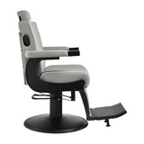 Gabbiano Levi barber chair in grey with black frame, featuring plush upholstery and modern barbershop furniture design