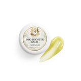 Skin Monarch Ink Booster Balm 30مل, غطاء بجانب مسحة من البلسم الأصفر اللامع